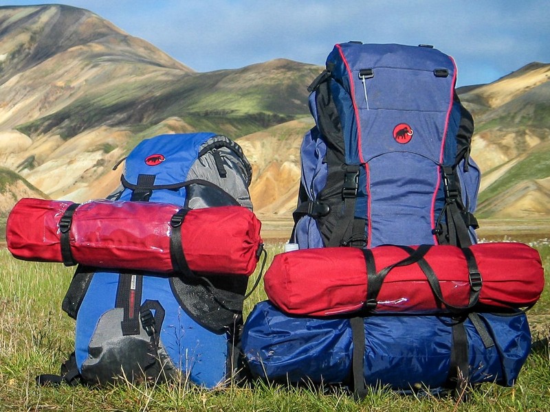 Rucksacks on a hillside. Book your Cumbria Way Baggage Transfer Service